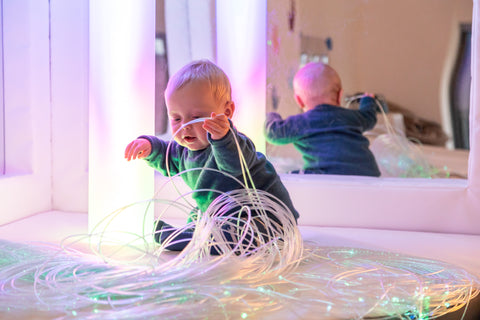 Baby In Sensory Room Playing