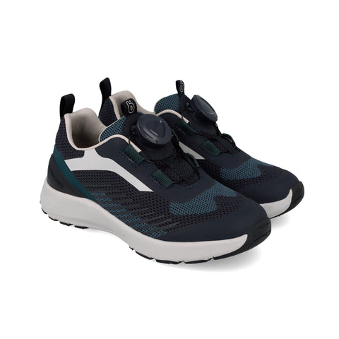 Pair of navy and white athletic shoes on a white background