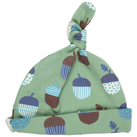Green baby hat with acorn pattern on a white background